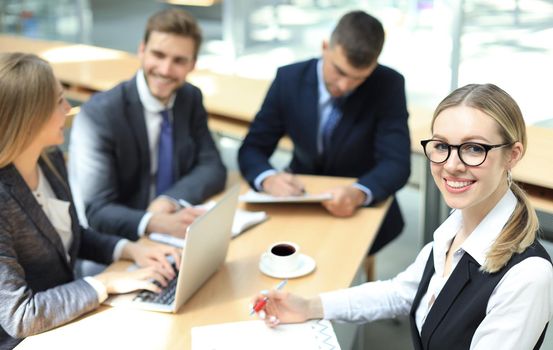 Top view of business people working together while spending time in the office