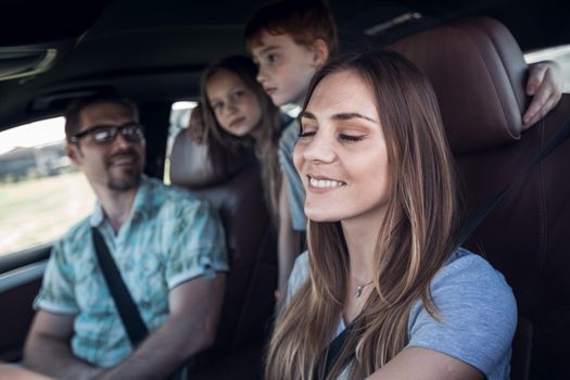 close up. the young woman behind the wheel of the family car.family holiday concept