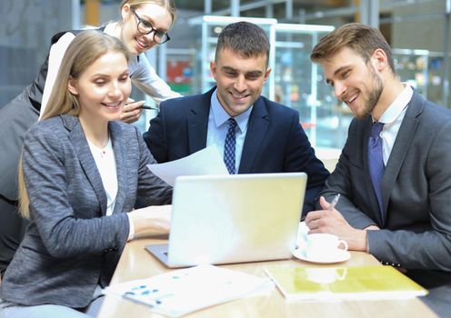 Image of business partners discussing documents and ideas at meeting