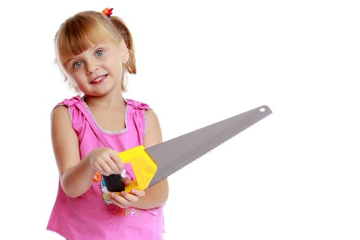 A little girl learns to handle a saw. The concept of construction, advertising.Isolated on a white background.