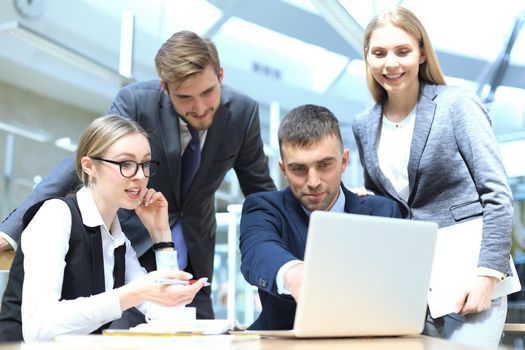 Image of business partners discussing documents and ideas at meeting