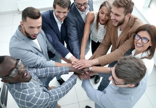 close up.modern business team standing in a circle.the concept of teamwork