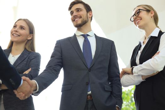 Business people shaking hands, finishing up a meeting