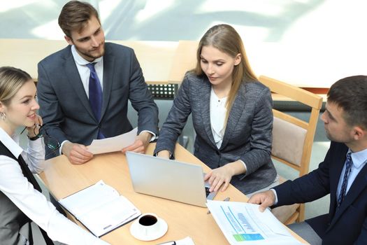 Image of business partners discussing documents and ideas at meeting