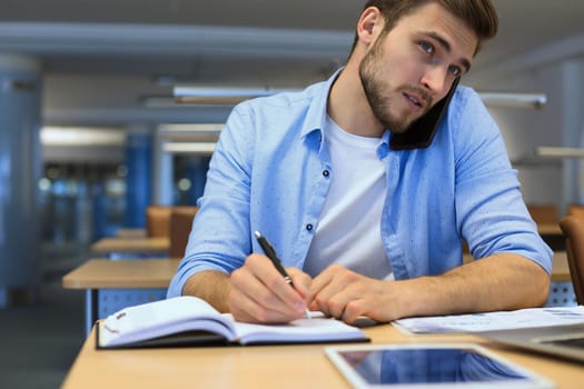 Businessman using his mobile phone in the office