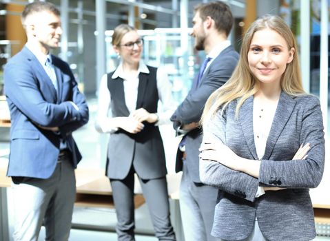 Face of beautiful woman on the background of business people