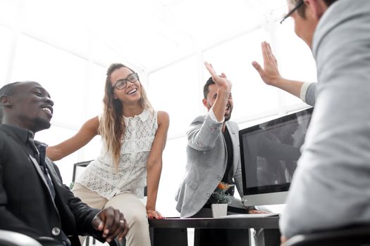 employees greet each other in the office.the concept of teamwork