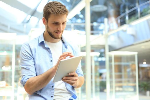 Businessman using his tablet in the office