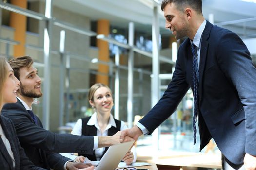 Business people shaking hands, finishing up a meeting