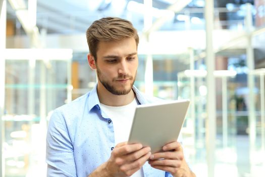Businessman using his tablet in the office