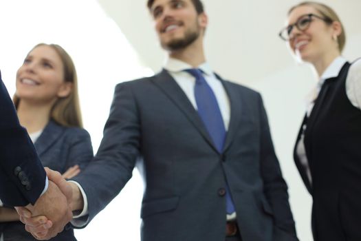 Business people shaking hands, finishing up a meeting