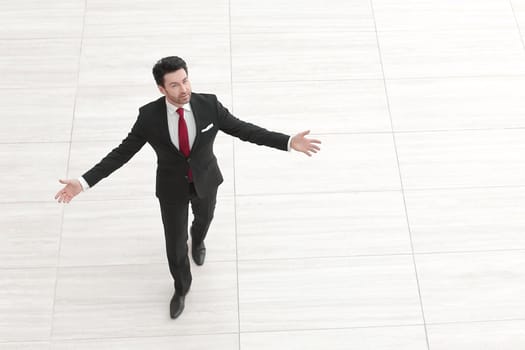 top view from afar.Businessman spreads his hands to the sides.photo with copy space