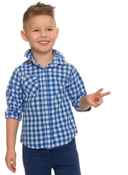 Cheerful little boy in a plaid shirt and blue shorts shows hand sign, Victoria - Isolated on white background - Isolated on white background