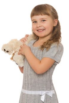 Happy little girl hugging soft toy . close-up - Isolated on white background