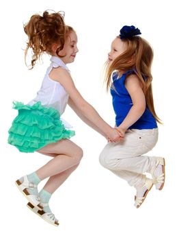 two happy little girls jumping and holding hands-Isolated on white background