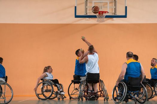 a photo of basketball teams with disabilities with the selector in the big hall before the start of the basketball game. Selective focus 