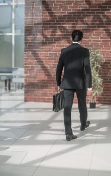 Business people walking in the office corridor.business background