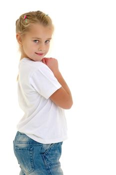 Portrait of a little girl close-up, in a clean white T-shirt and jeans. On the shirt you can put a logo or any other inscription. The concept of advertising on clothes, Happy childhood. Isolated on white background.