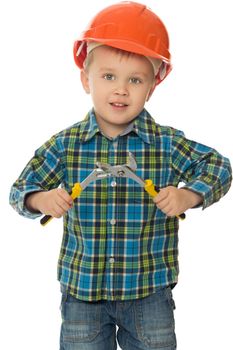Cute little boy in a helmet. Boy holding a pair of pliers . close-up - Isolated on white background