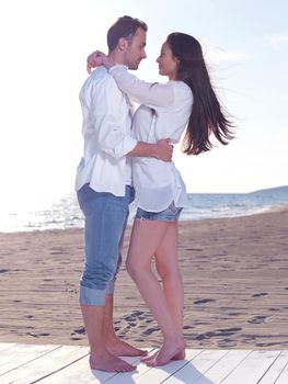 happy young romantic couple in love have fun on beautiful beach at beautiful summer day