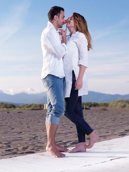 happy young romantic couple in love have fun on beautiful beach at beautiful summer day