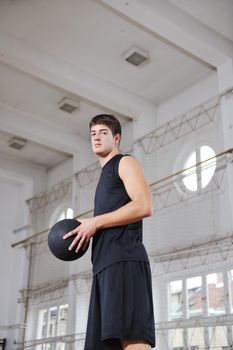 young and healthy people man have recreation and training exercise  while play basketball game at sport gym indoor hall