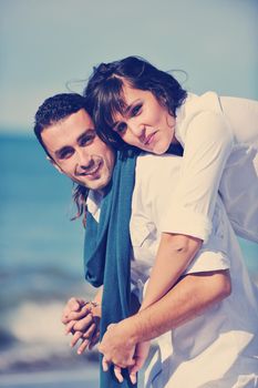 happy young couple in white clothing  have romantic recreation and   fun at beautiful beach on  vacations