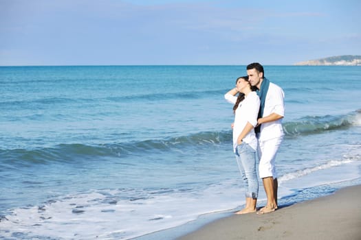 happy young couple in white clothing  have romantic recreation and   fun at beautiful beach on  vacations