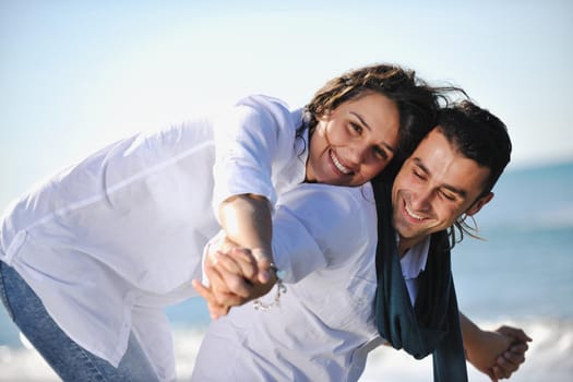 happy young couple in white clothing  have romantic recreation and   fun at beautiful beach on  vacations