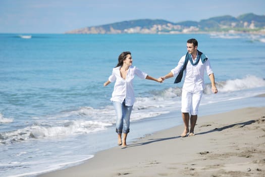 happy young couple in white clothing  have romantic recreation and   fun at beautiful beach on  vacations