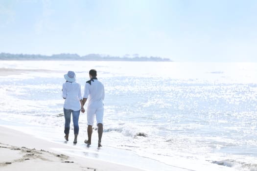 happy young couple in white clothing  have romantic recreation and   fun at beautiful beach on  vacations