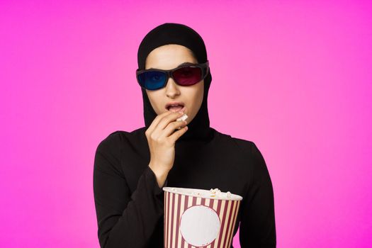 arab woman attractive look popcorn glasses movie watching studio lifestyle. High quality photo