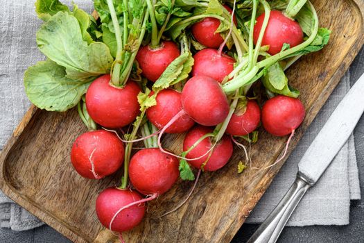 Fresh farm radish, rustic background. Natural eco products set, on gray stone background, top view flat lay