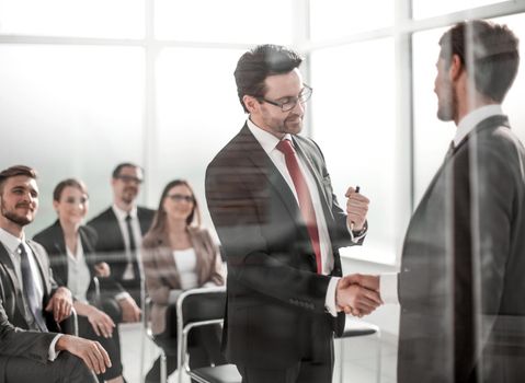 handshake business partners at the meeting in the conference room.the concept of cooperation