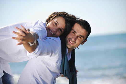 happy young couple in white clothing  have romantic recreation and   fun at beautiful beach on  vacations