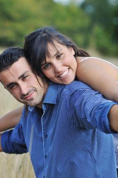 happy young couple have romantic time outdoor while smiling and hug