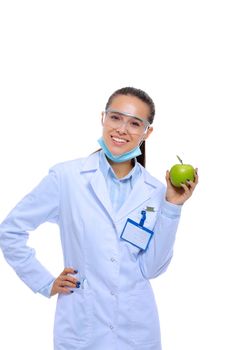 Dentist medical doctor woman hold green fresh apple in hand and tooth brush. Dentist doctors. Woman doctors.