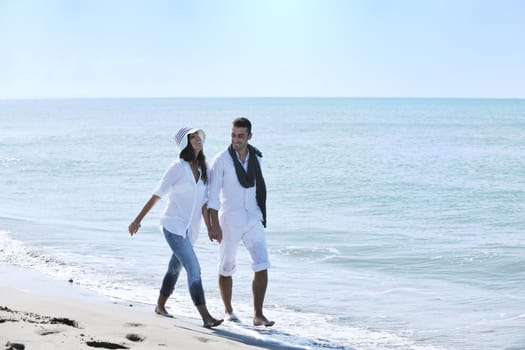 happy young couple in white clothing  have romantic recreation and   fun at beautiful beach on  vacations