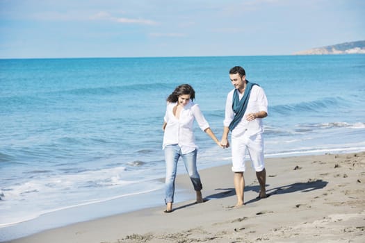 happy young couple in white clothing  have romantic recreation and   fun at beautiful beach on  vacations