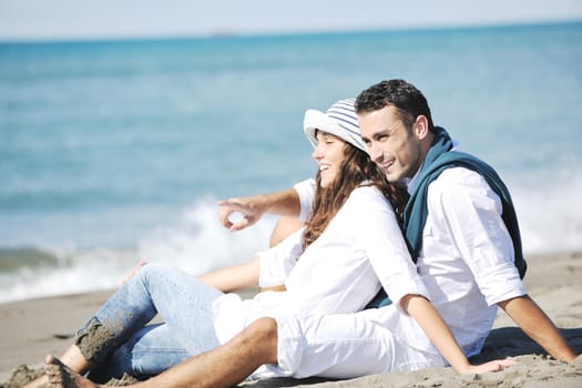 happy young couple in white clothing  have romantic recreation and   fun at beautiful beach on  vacations