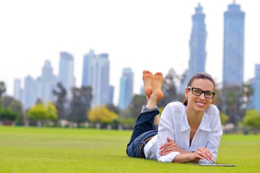 Beautiful young student  woman study with tablet in park