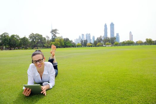Beautiful young student  woman study with tablet in park