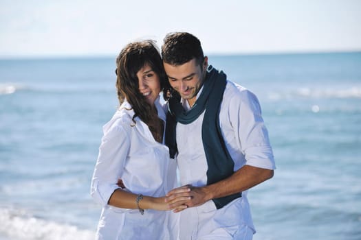 happy young couple in white clothing  have romantic recreation and   fun at beautiful beach on  vacations