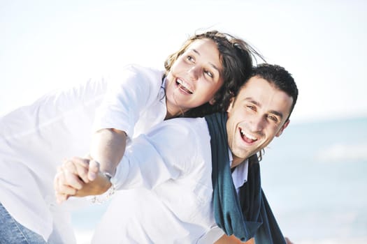 happy young couple in white clothing  have romantic recreation and   fun at beautiful beach on  vacations