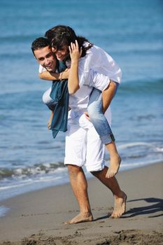 happy young couple in white clothing  have romantic recreation and   fun at beautiful beach on  vacations