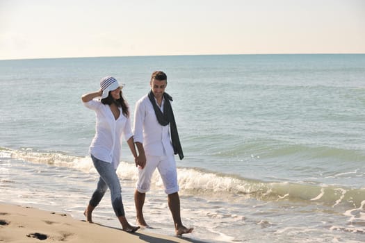 happy young couple in white clothing  have romantic recreation and   fun at beautiful beach on  vacations