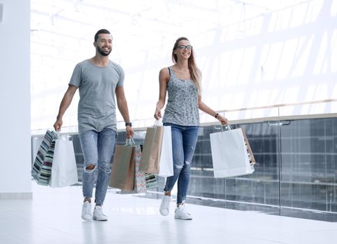 modern couple with shopping bags.photo with copy space