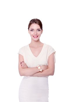 Attractive businesswoman standing near wall in office .