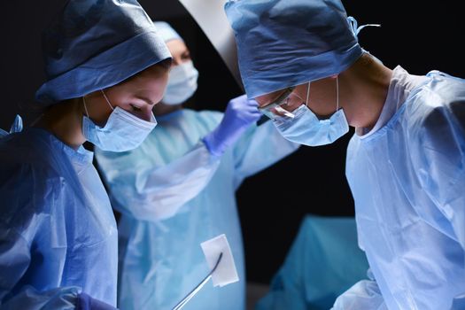 Team surgeon at work in operating room