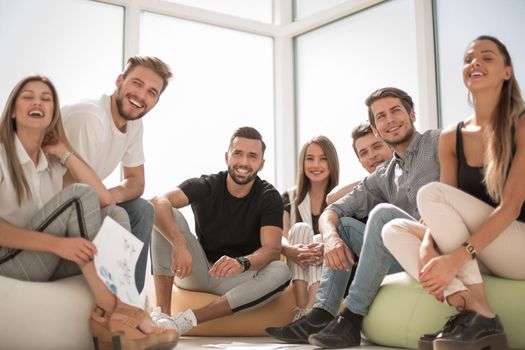 group of successful young people sitting in a new office.business concept